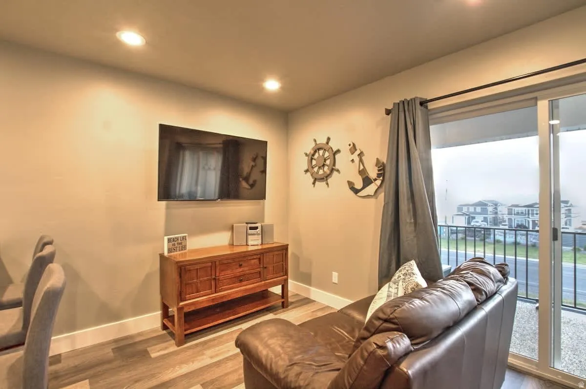 Living area featuring wood finished floors and recessed lighting