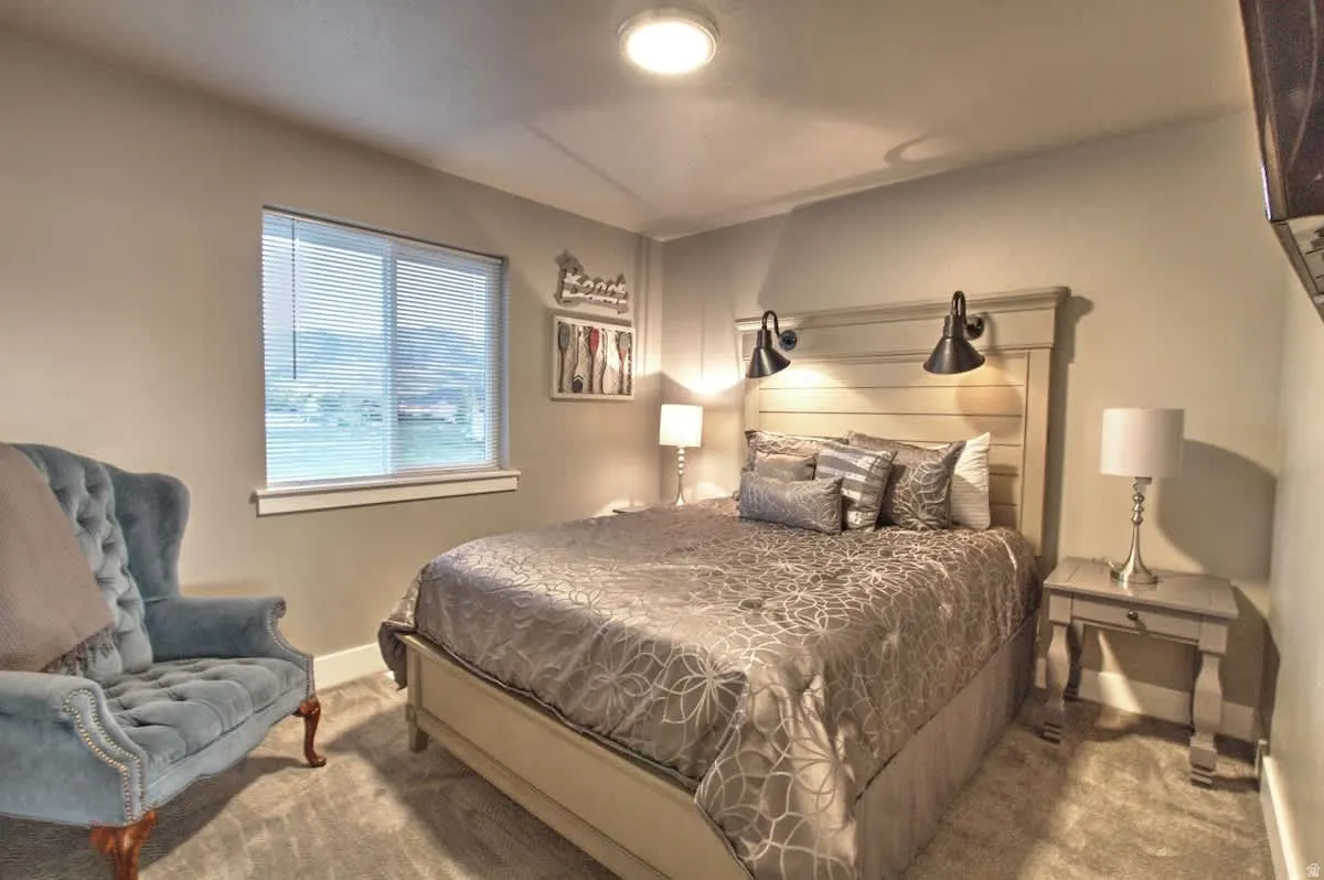 Bedroom with carpet flooring and baseboards