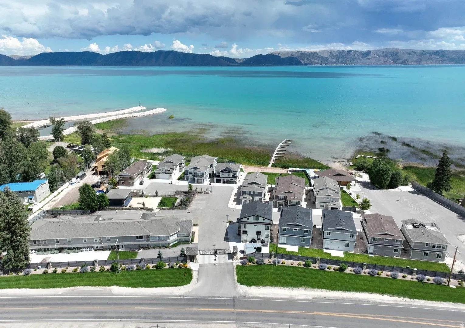 Aerial view of residential area featuring a water and mountain view