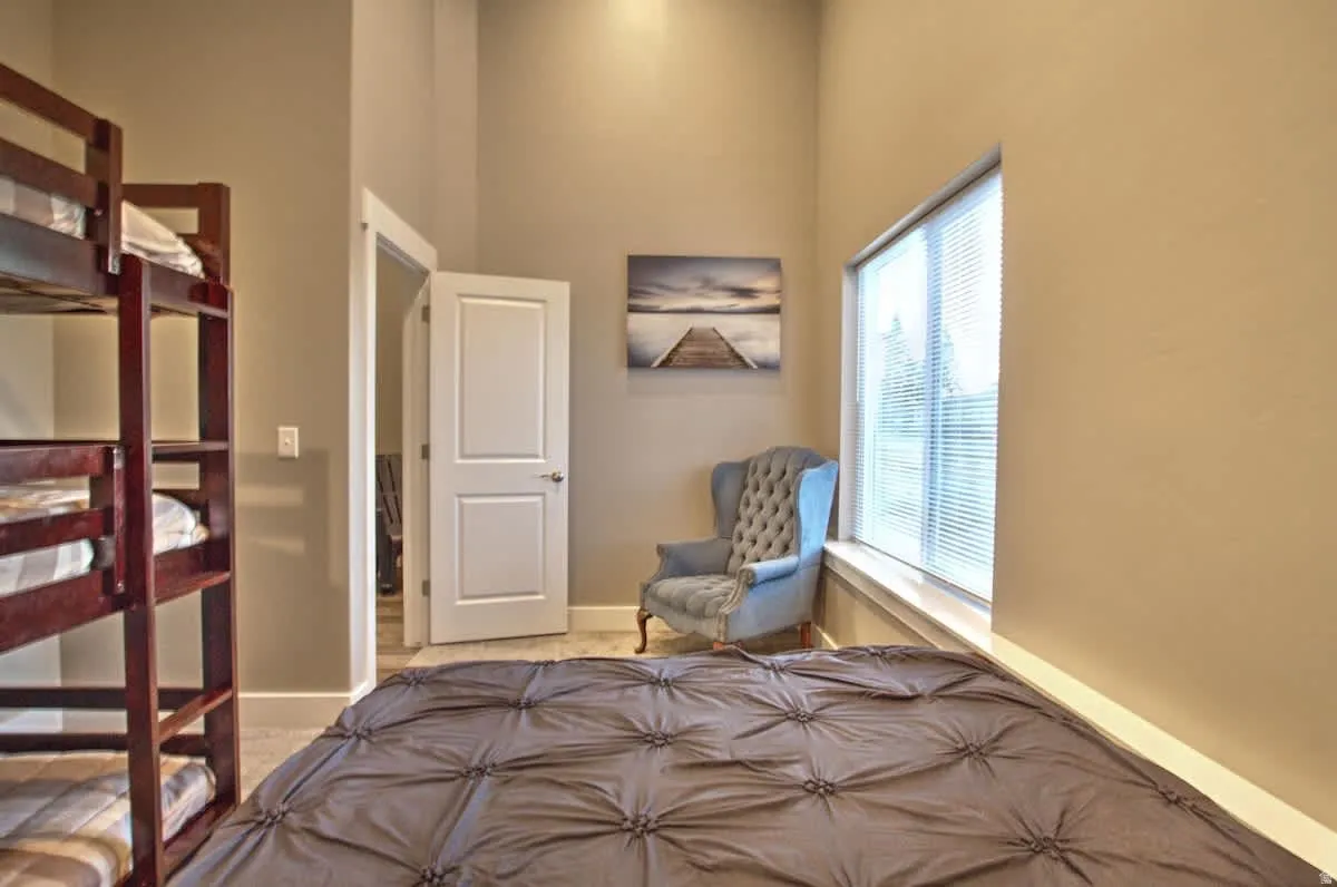 Bedroom featuring a high ceiling