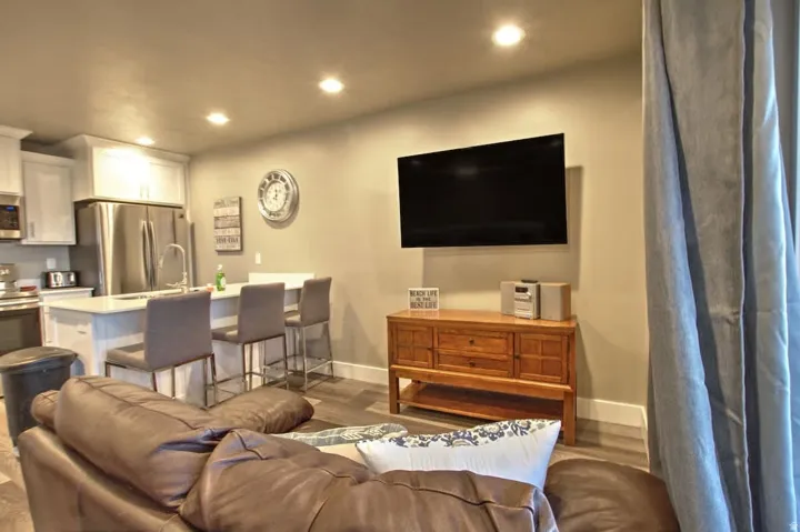 Living room with wood finished floors and recessed lighting