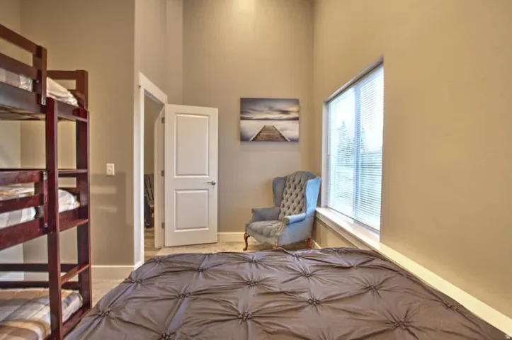 Bedroom featuring a high ceiling