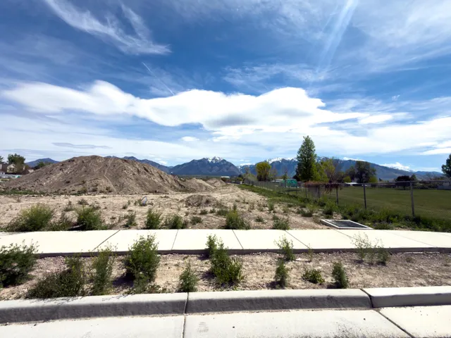 View of mountain background featuring rural landscape