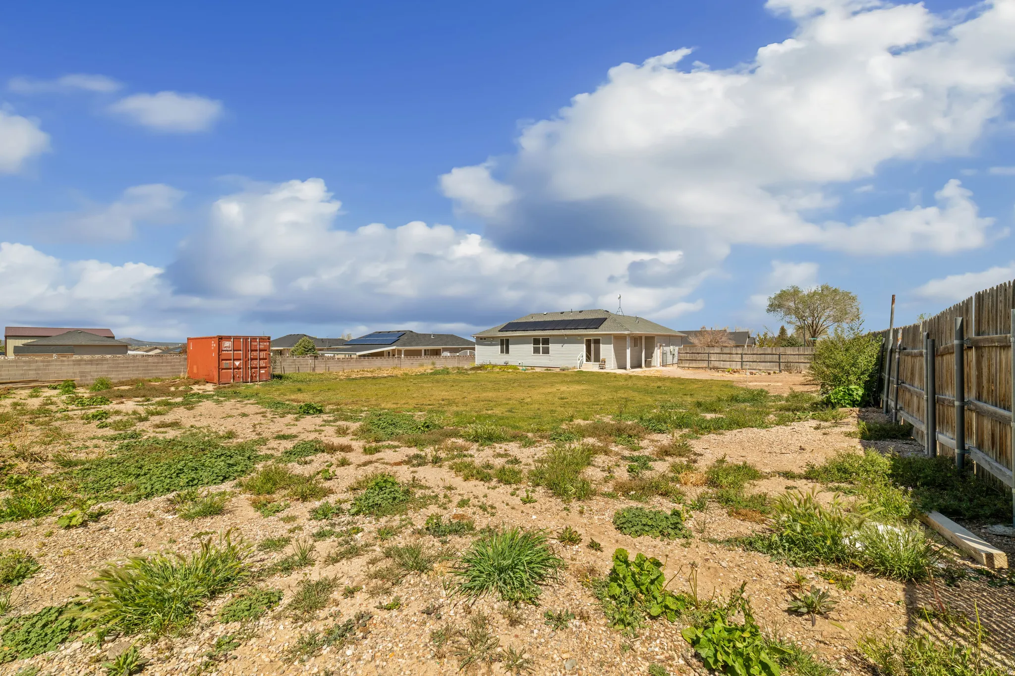 View of fenced backyard