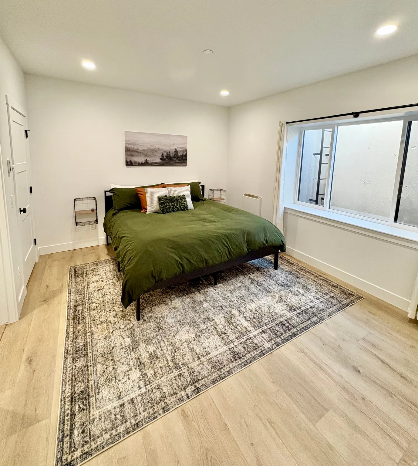 Bedroom with light wood-style flooring and recessed lighting