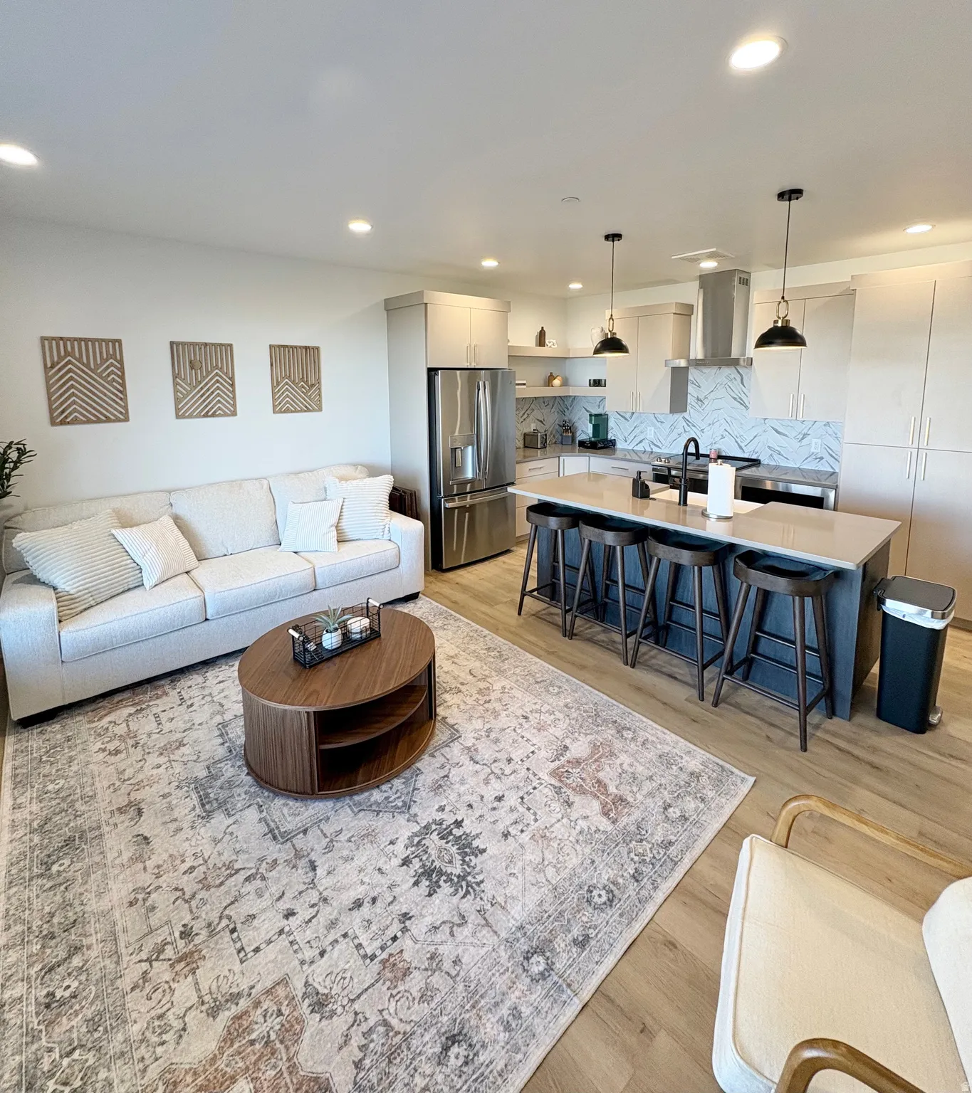 Living room featuring light wood-style floors and recessed lighting