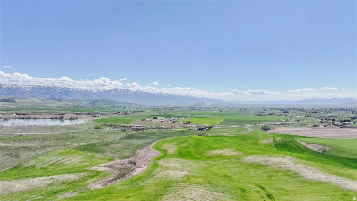View of home's community with a water and mountain view and golf course view