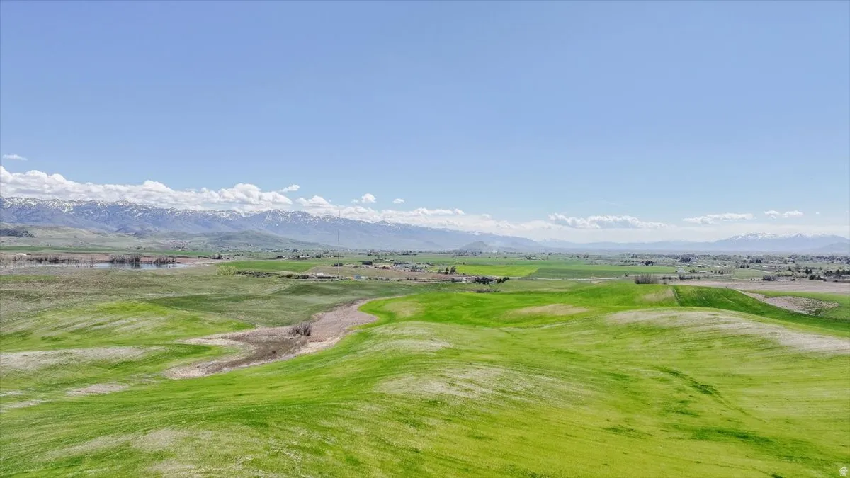 Surrounding community with a mountain view and view of golf course