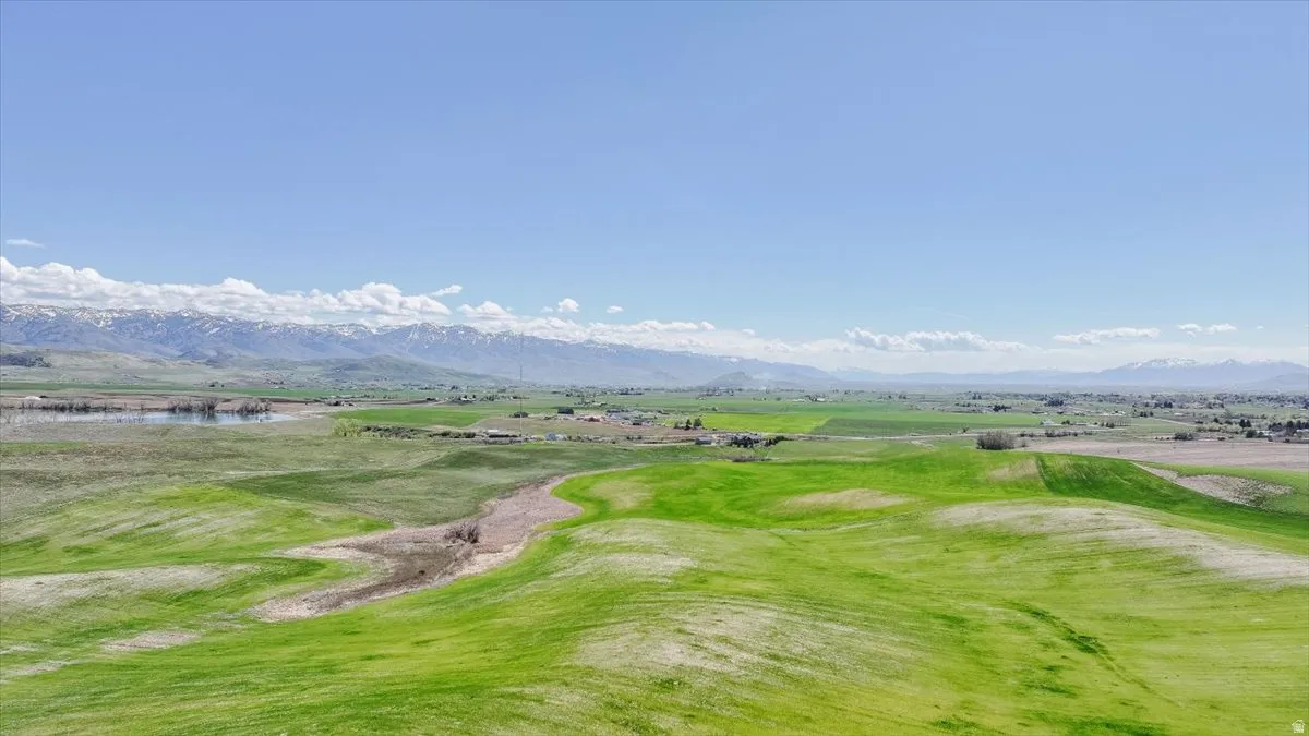 View of property's community with a mountain view and view of golf course
