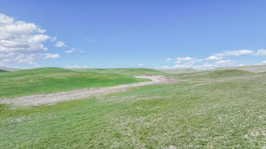 View of grassy yard featuring a mountain view