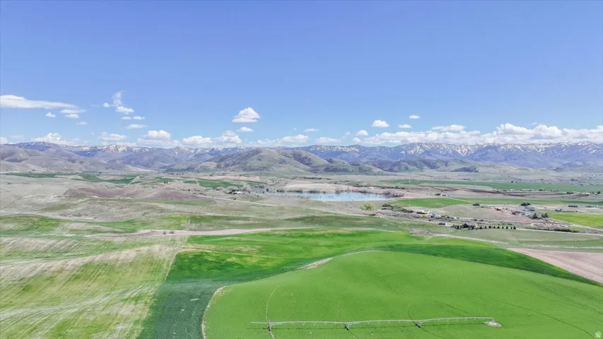 View of mountain backdrop featuring a nearby body of water