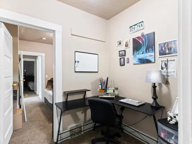 Carpeted interior room with neutral-toned walls