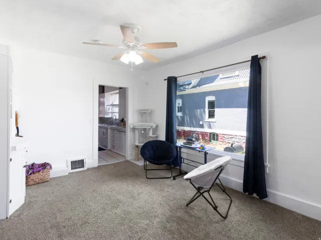 Neutral tone carpeting complements bright white walls