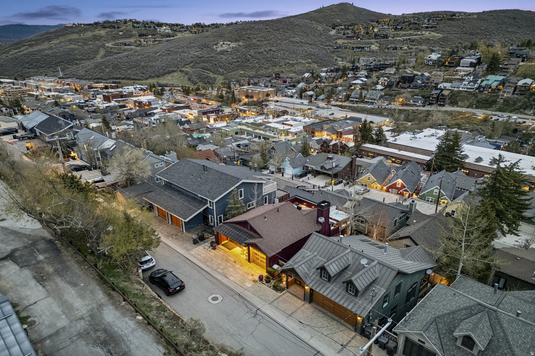 Aerial perspective of suburban area featuring a mountainous background