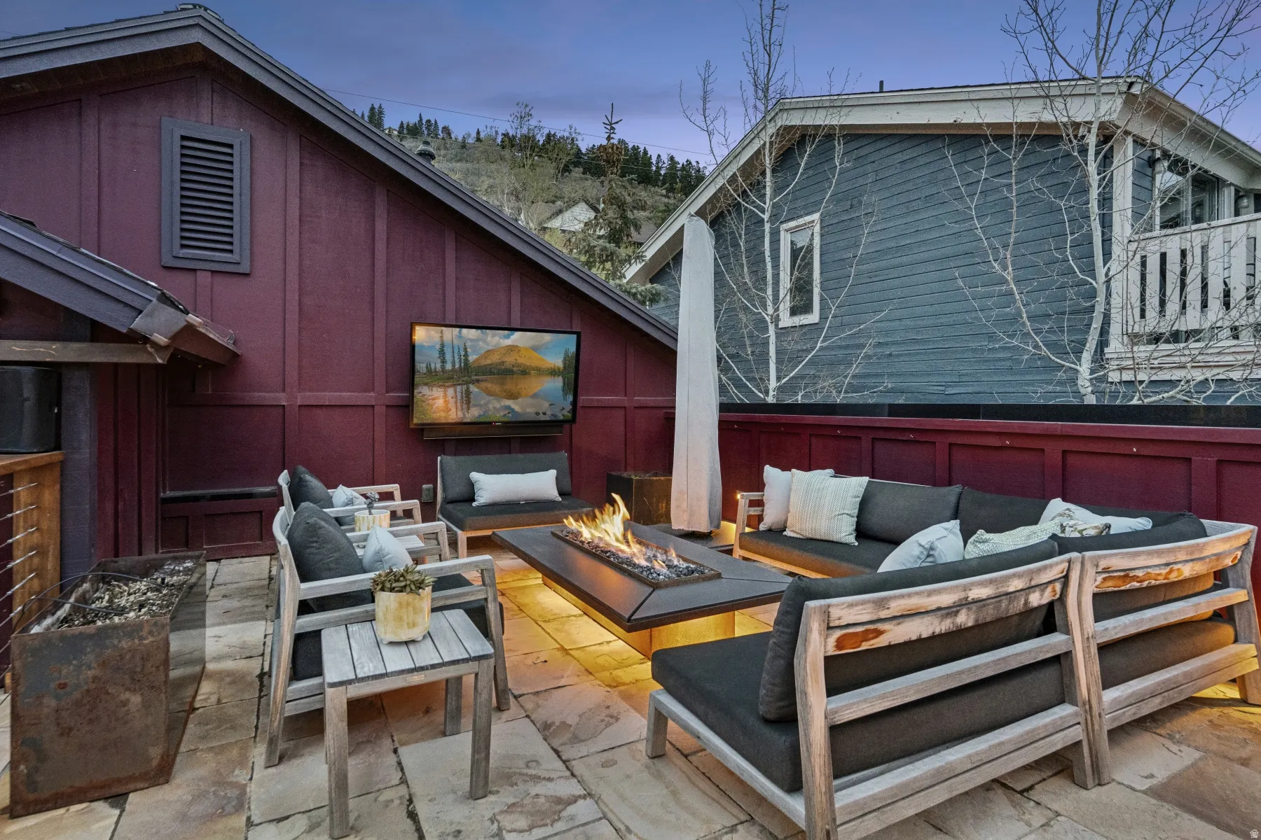 View of patio with an outdoor living space with a fire pit