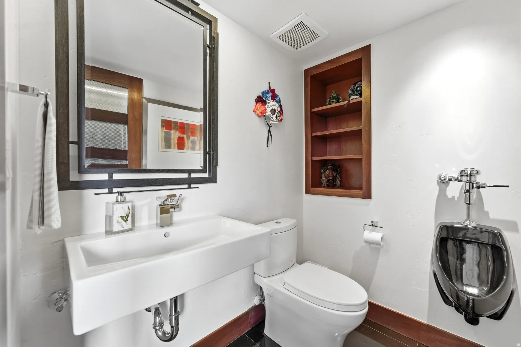 Half bath featuring toilet and built in shelves
