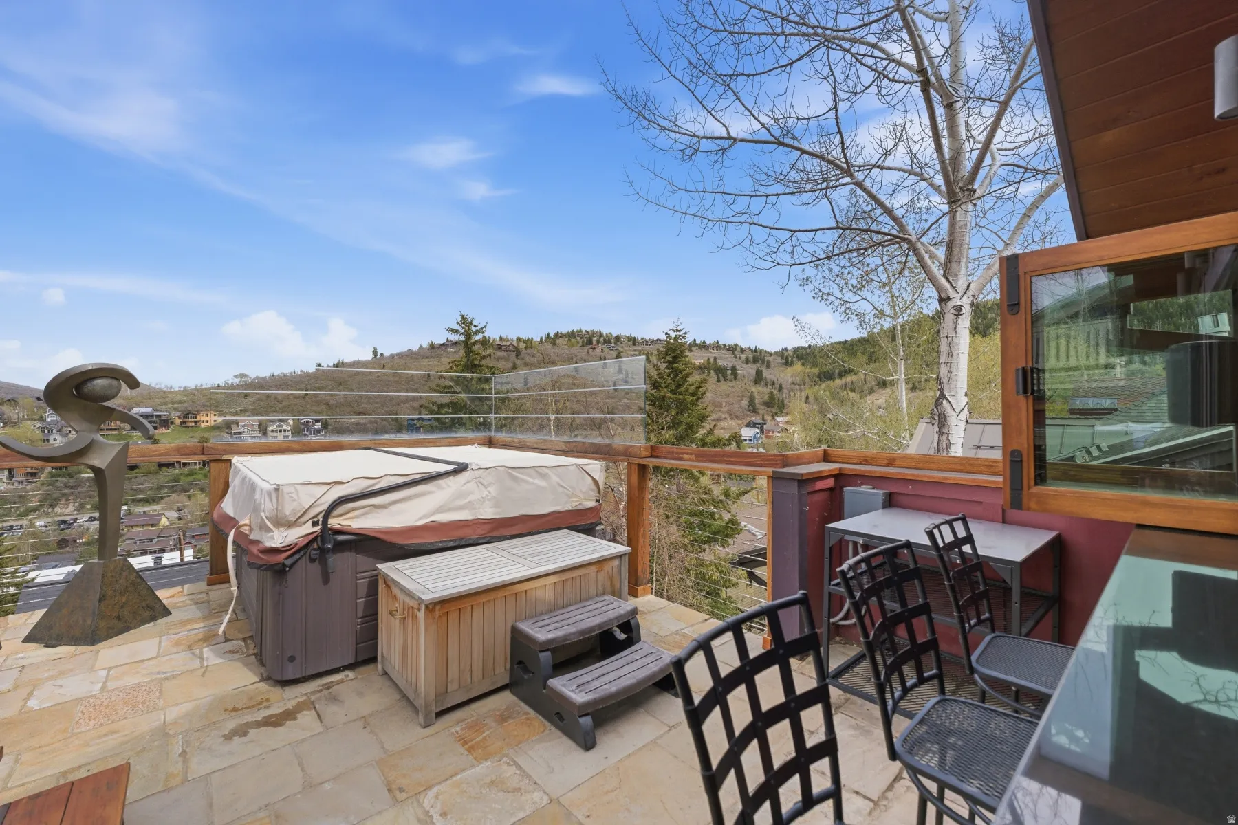 View of patio featuring a hot tub