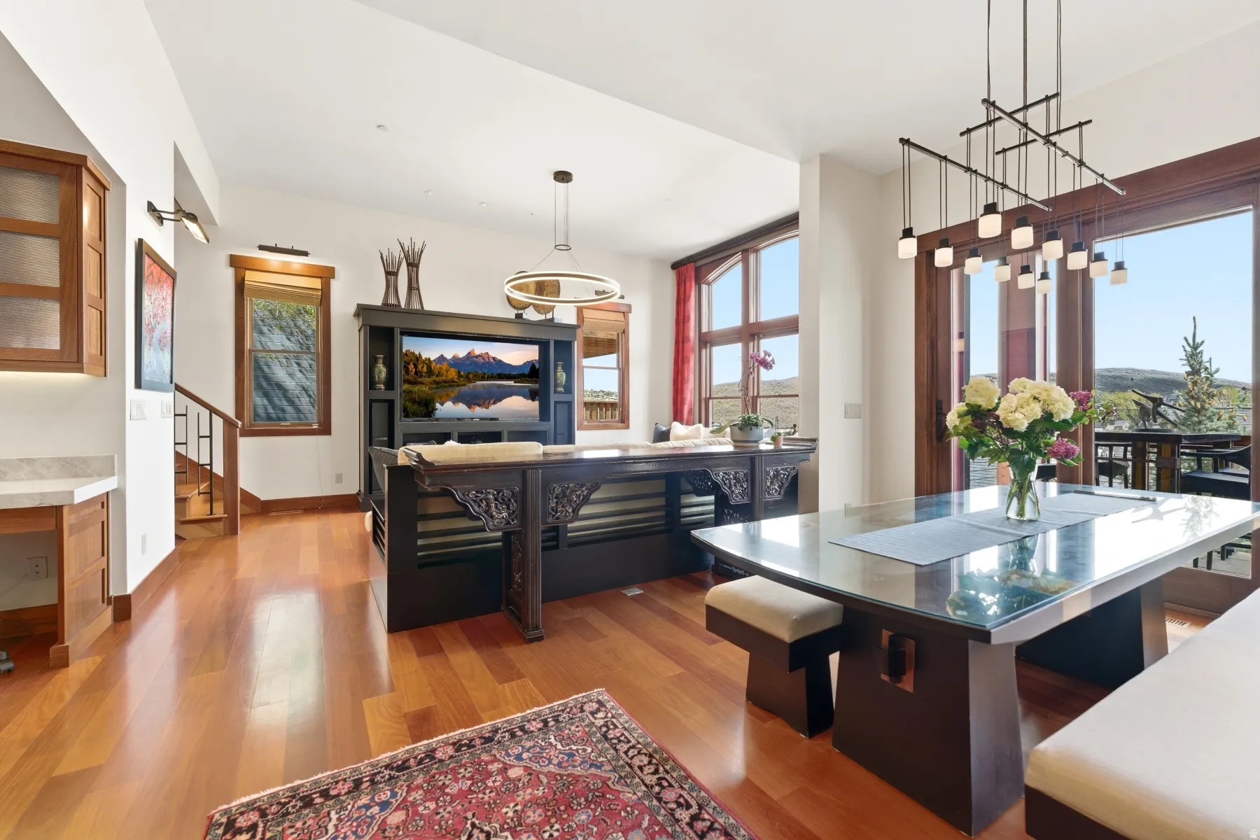 Dining area featuring light wood finished floors and healthy amount of natural light