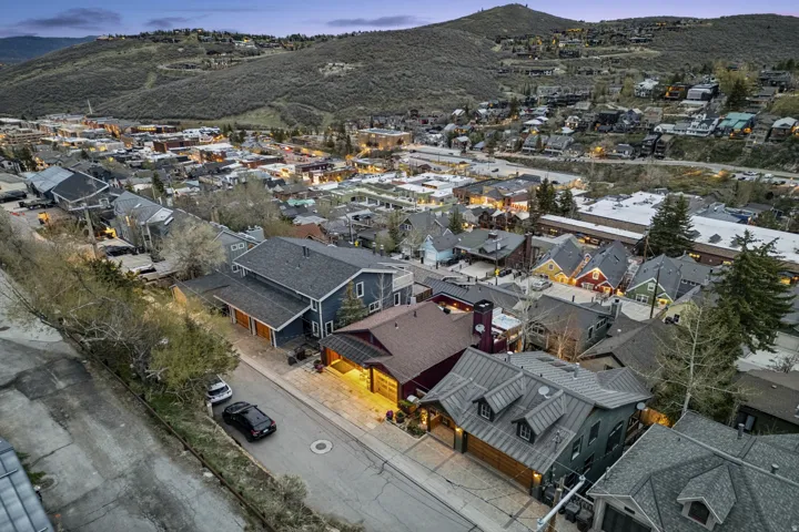 Aerial perspective of suburban area featuring a mountainous background