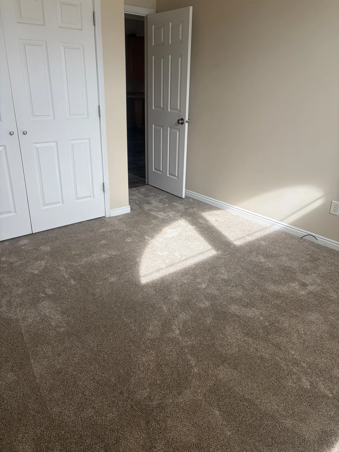 Finished bedroom featuring carpet flooring and a closet