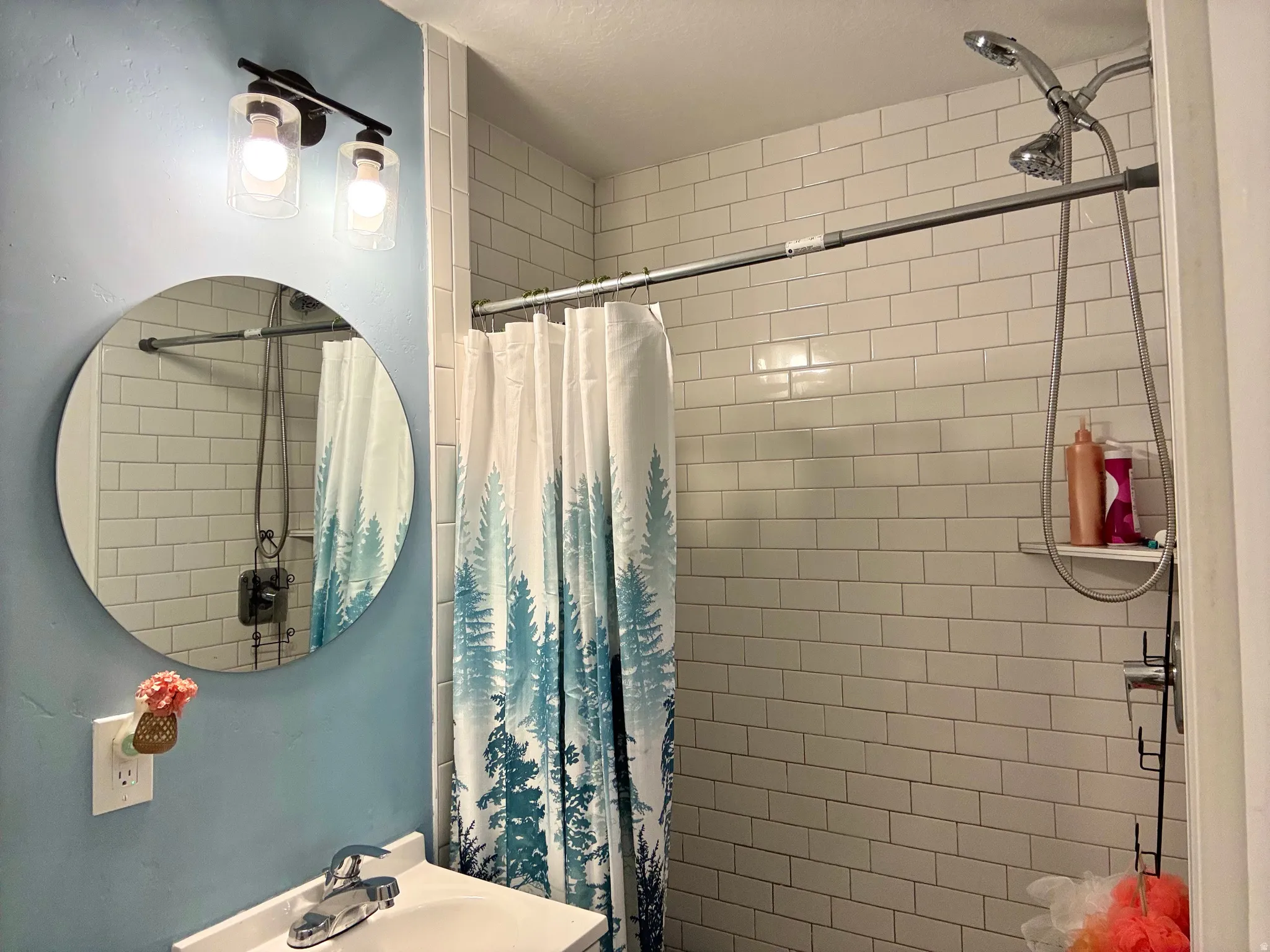 Full bathroom featuring a stall shower and vanity