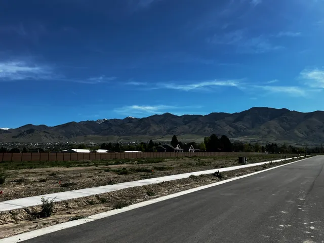 View of mountain backdrop with rural landscape