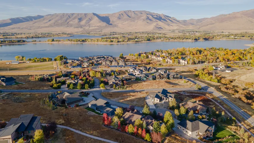 Aerial perspective of suburban area with a water and mountain view