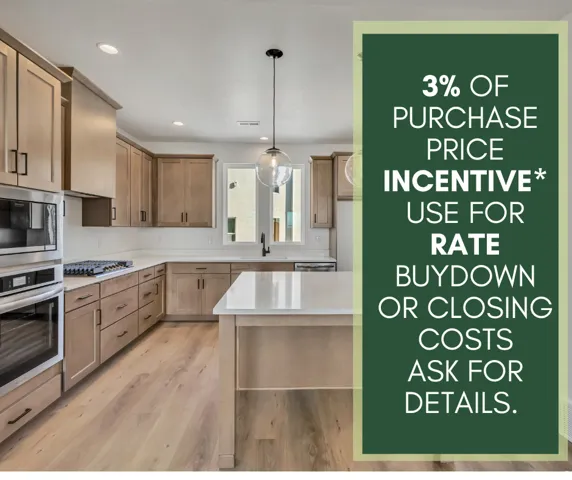 Kitchen featuring wood-finish flooring, light-toned cabinetry, a central island with a solid surface countertop, stainless steel double ovens, and a gas range