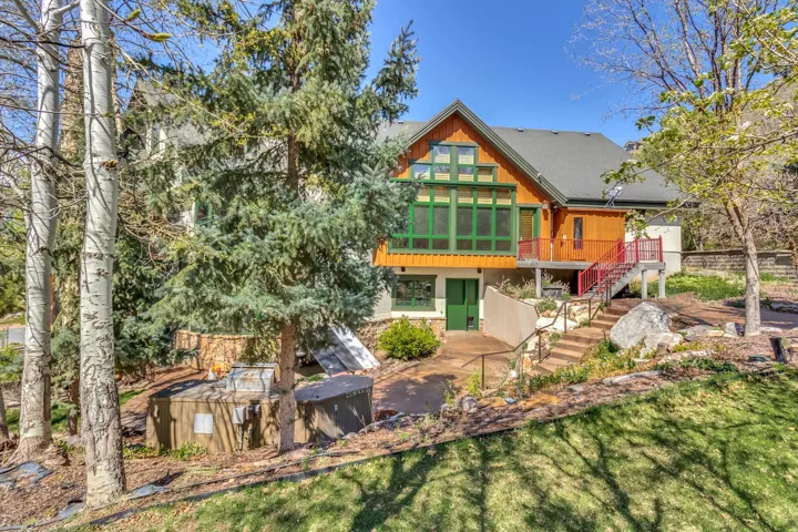 Large backyard terrace, perfect for outdoor entertaining. Easily access the kitchen, sport court, and Owner’s suite from entrances along the back of the house.