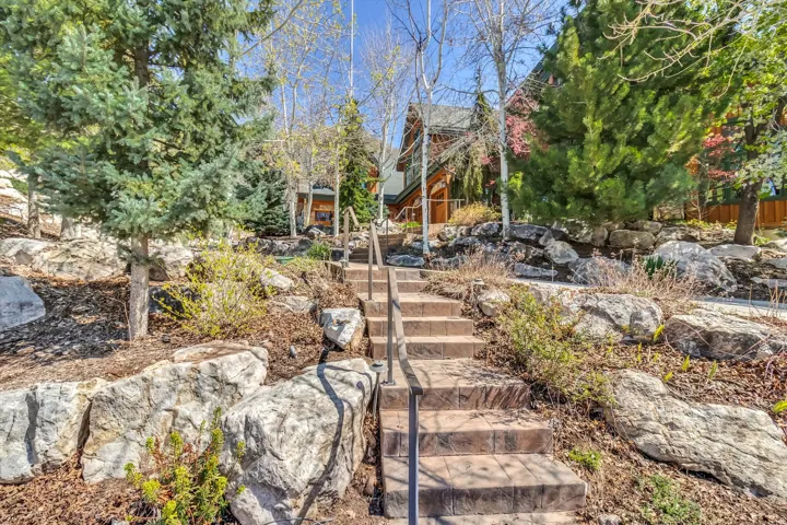 Tiered front yard offers access from street level via heated steps.