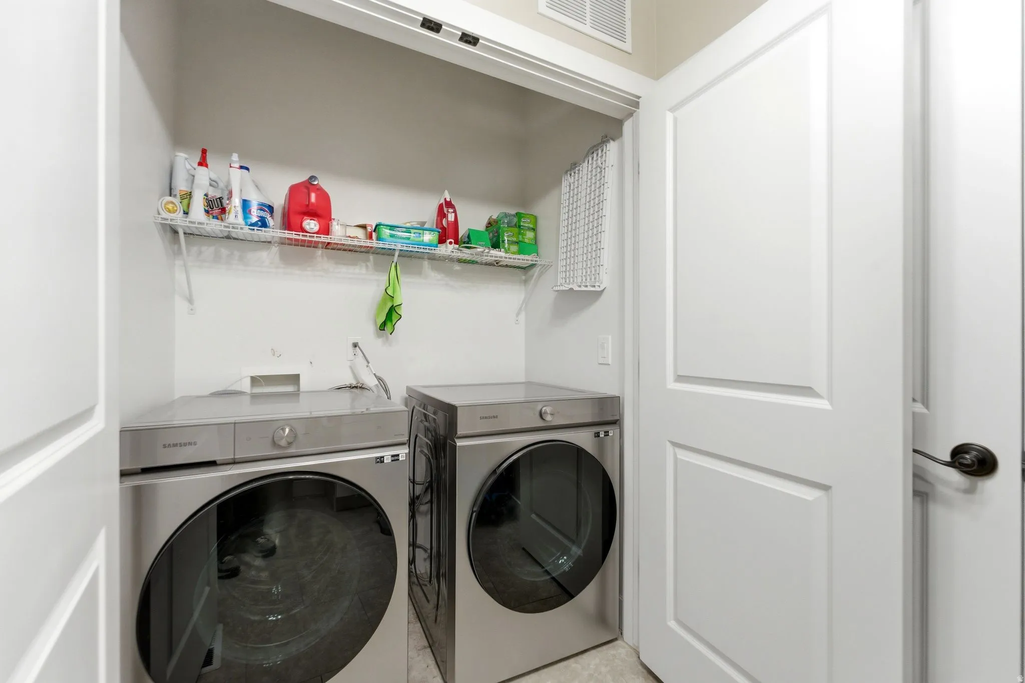 Laundry area with separate washer and dryer, main floor.