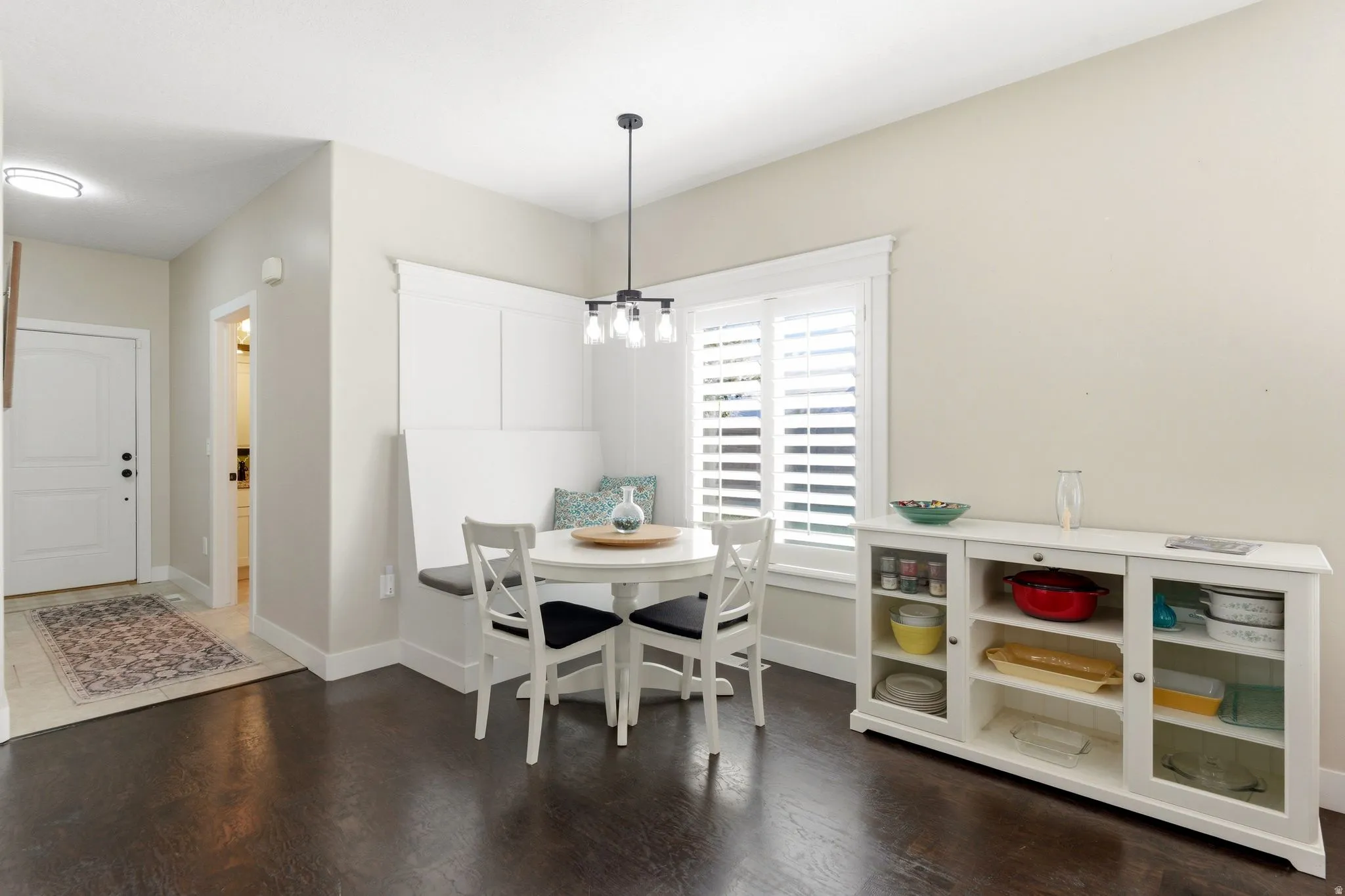 Dining room with dark wood finished floors and breakfast area