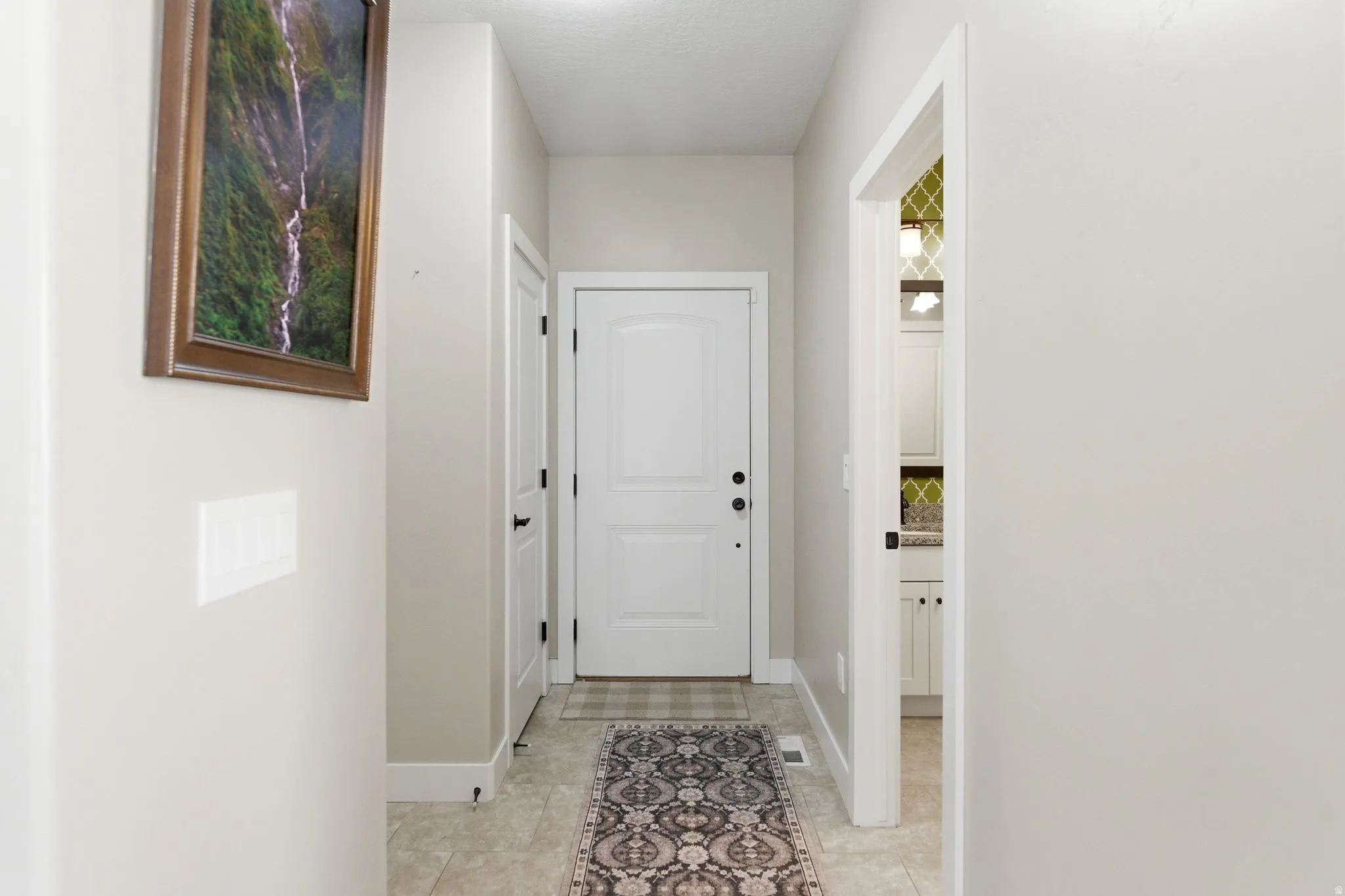 Entryway featuring baseboards