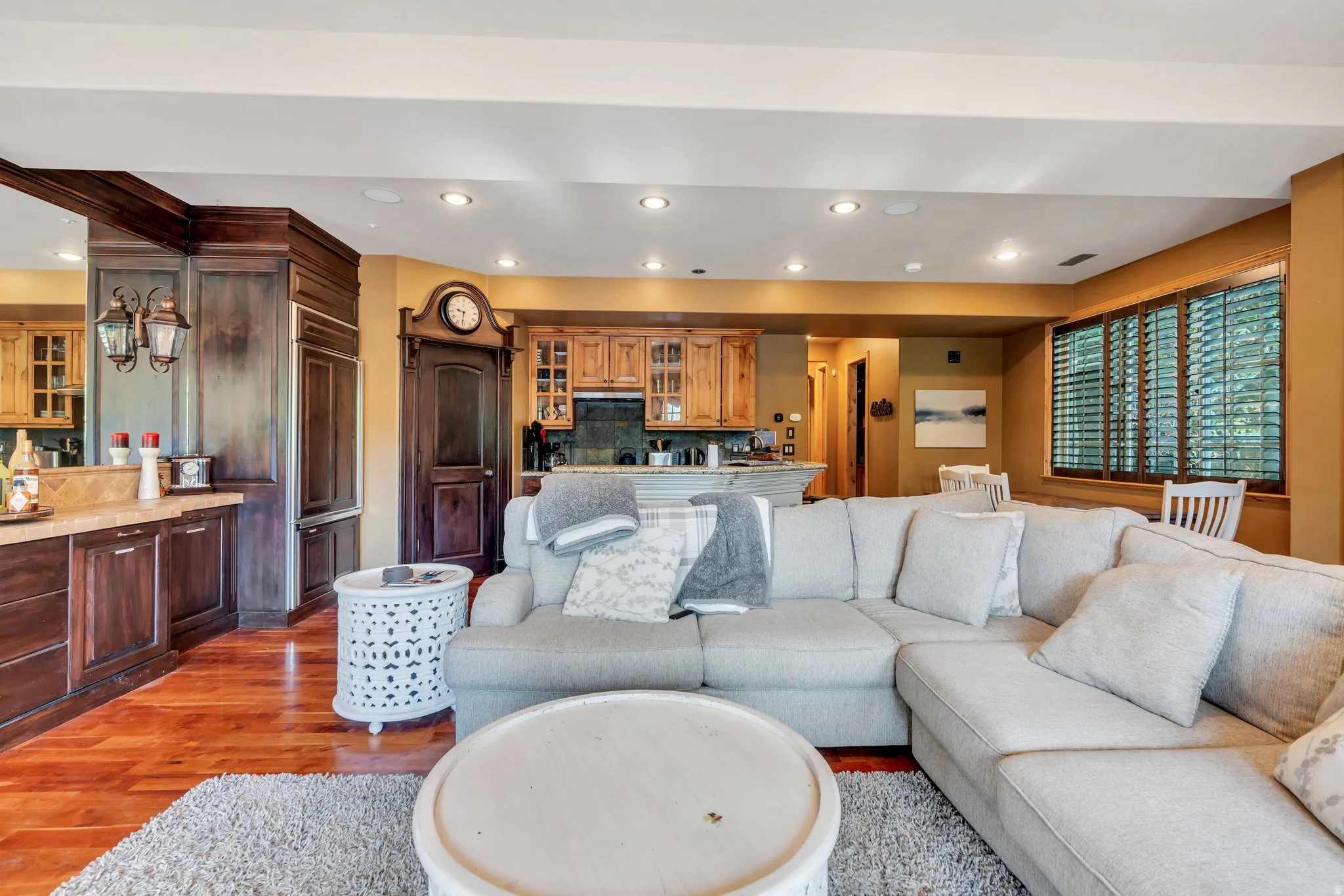 Living room with recessed lighting and wood finished floors
