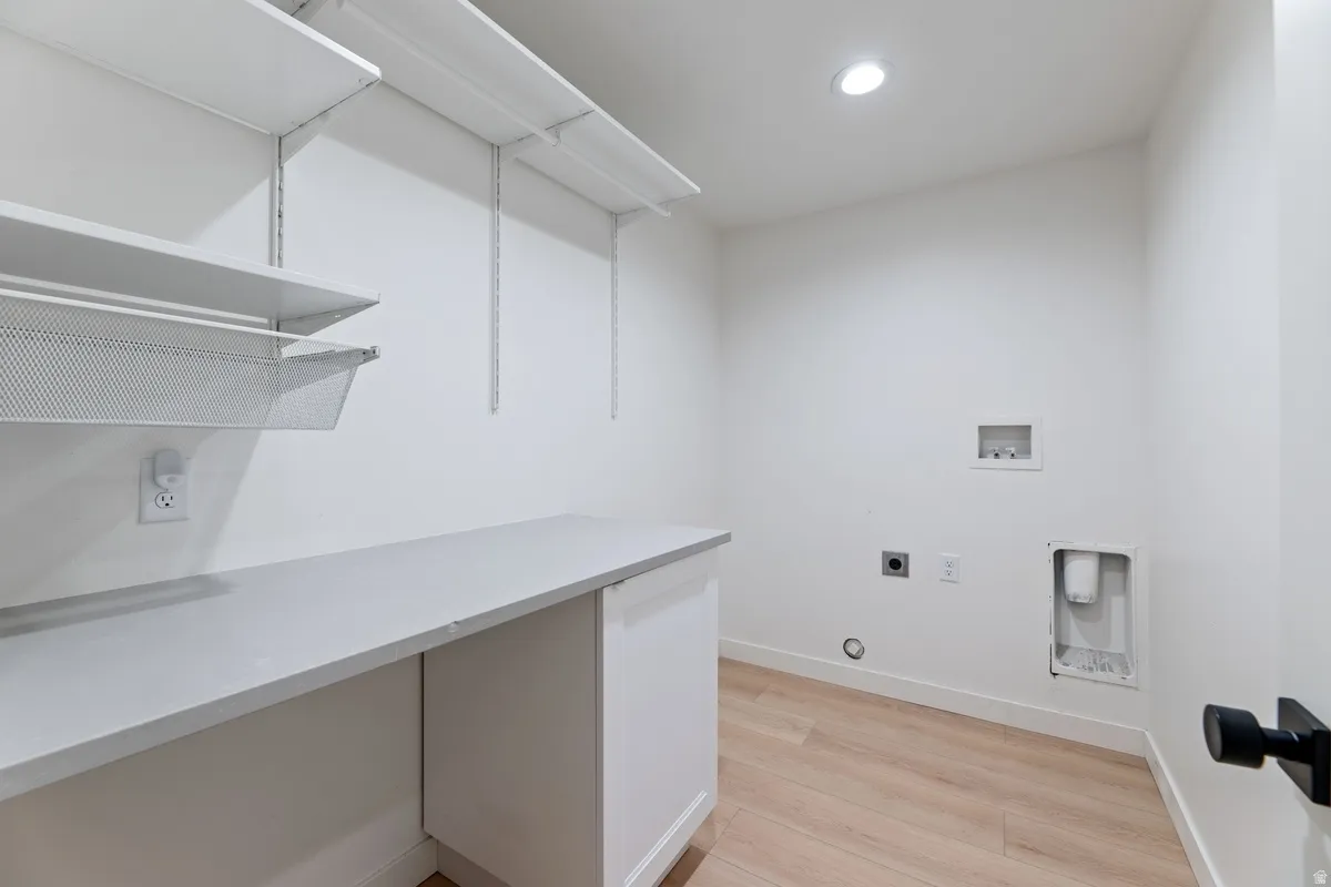 Laundry room featuring washer hookup, light wood-style flooring, electric dryer hookup, recessed lighting, and gas dryer hookup