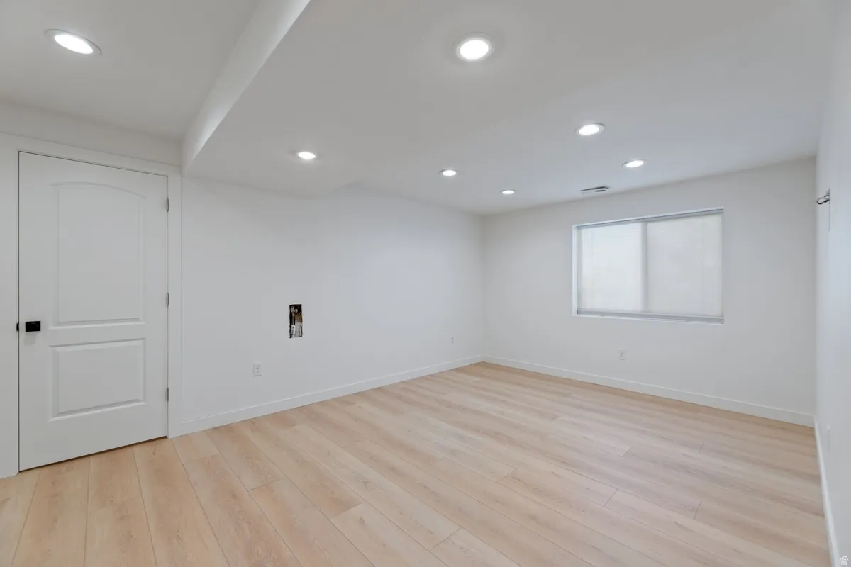 Spare room featuring recessed lighting and light wood-type flooring