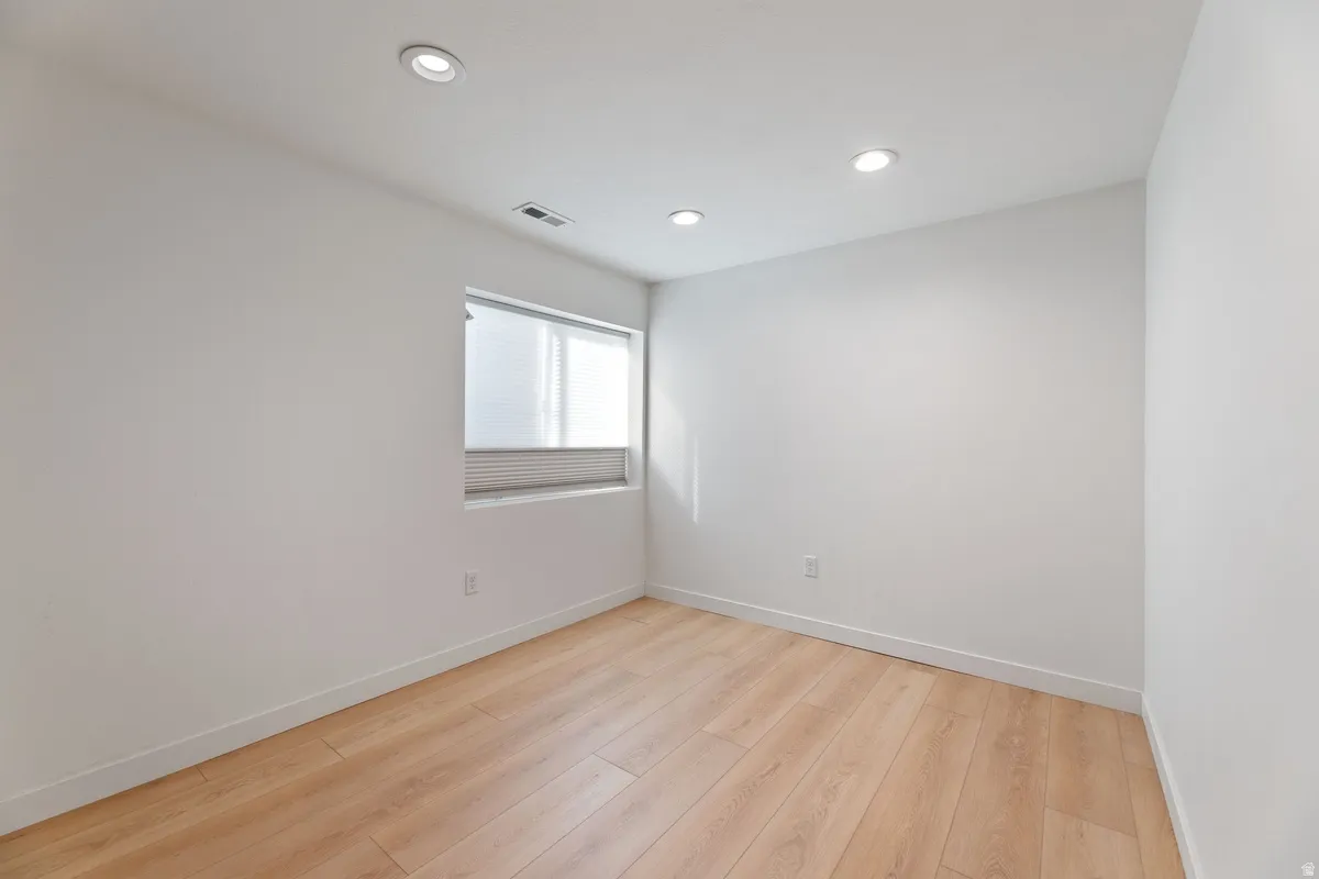 Unfurnished room featuring light wood-style flooring and recessed lighting