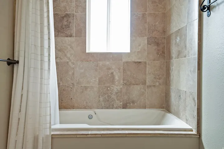 Bathroom featuring shower / bath combo