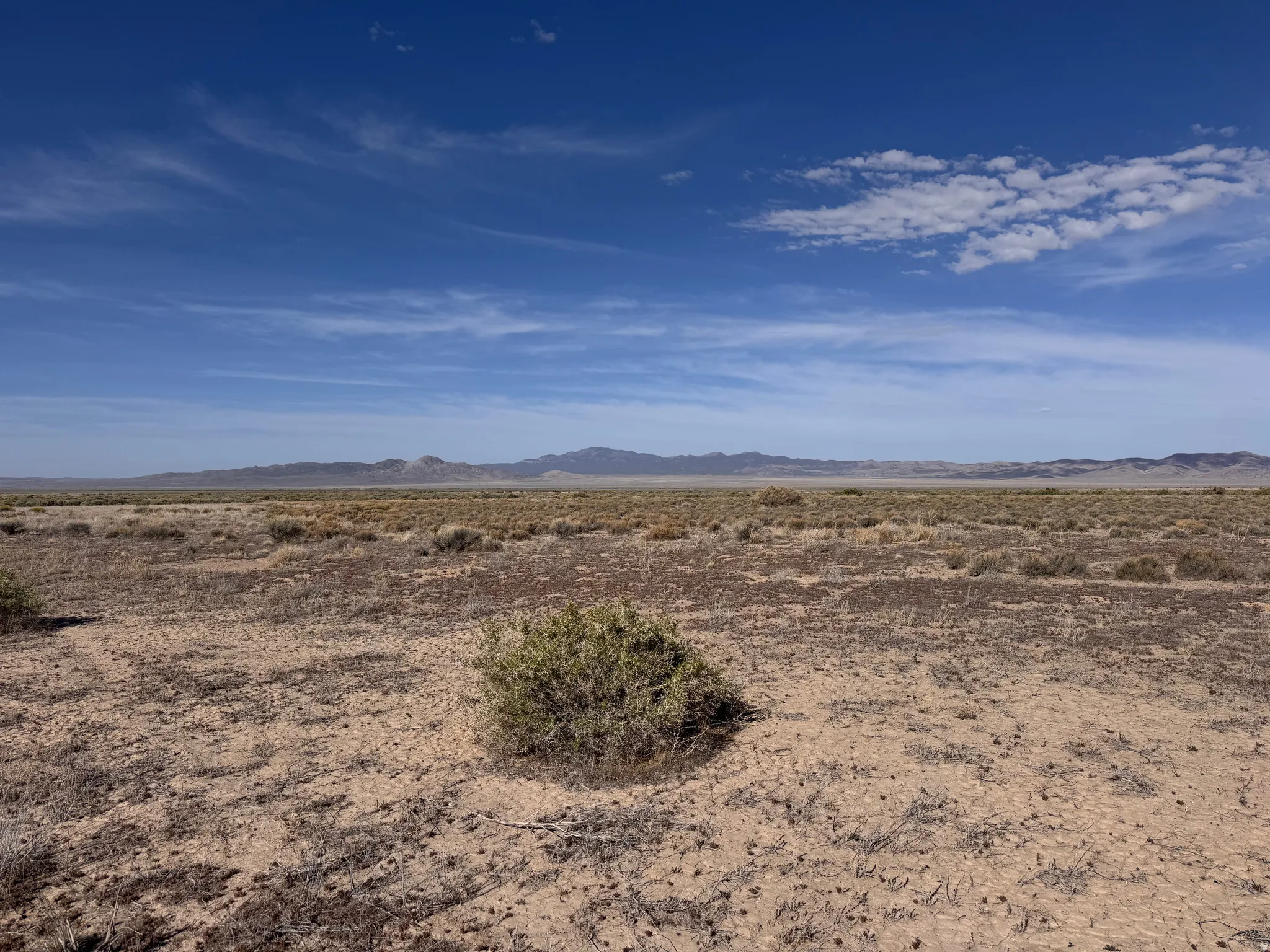 View of mountain backdrop featuring a desert landscape