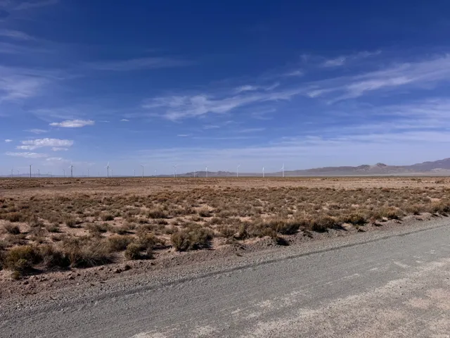 View of road with view of desert, a mountain view, and a view of countryside