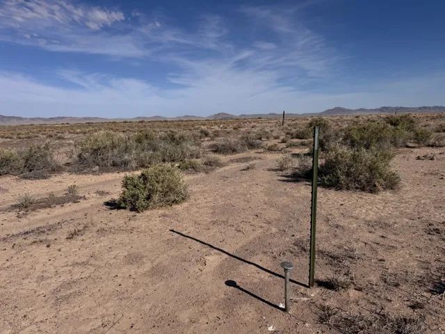 View of yard featuring view of desert and a mountain view