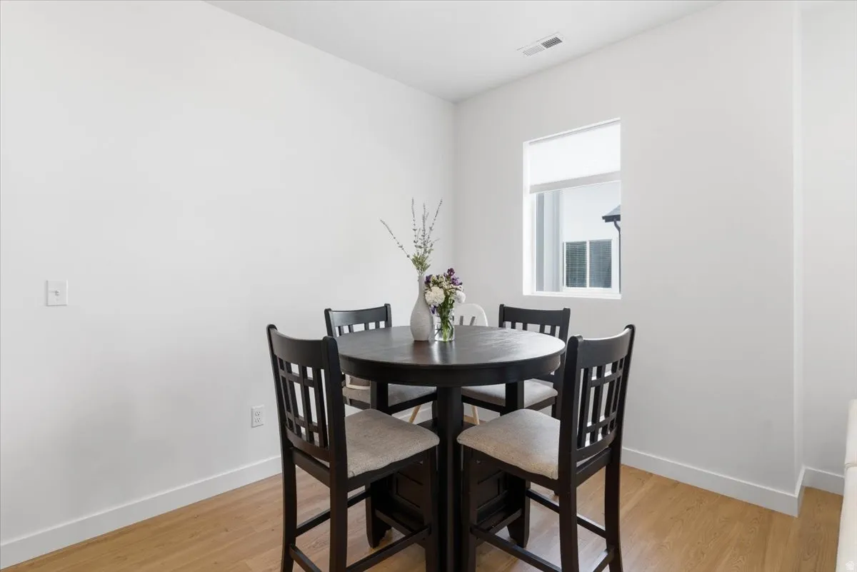 Dining space featuring light wood finished floors and baseboards