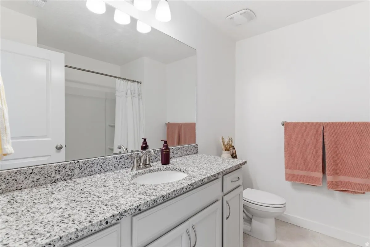 Bathroom featuring vanity and a shower with curtain