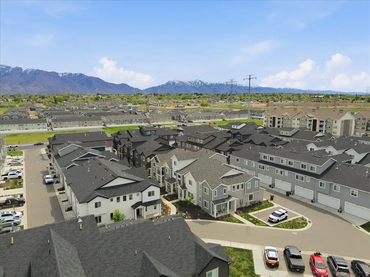 Aerial view of residential area featuring a mountain backdrop