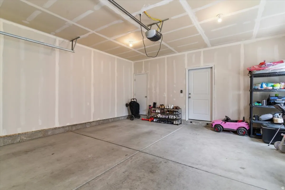 Garage featuring a garage door opener