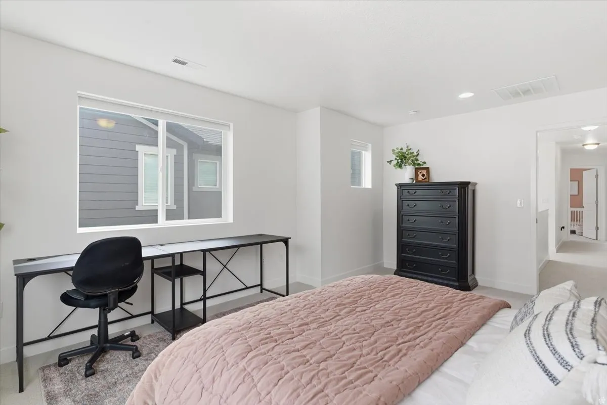 Bedroom featuring carpet and recessed lighting