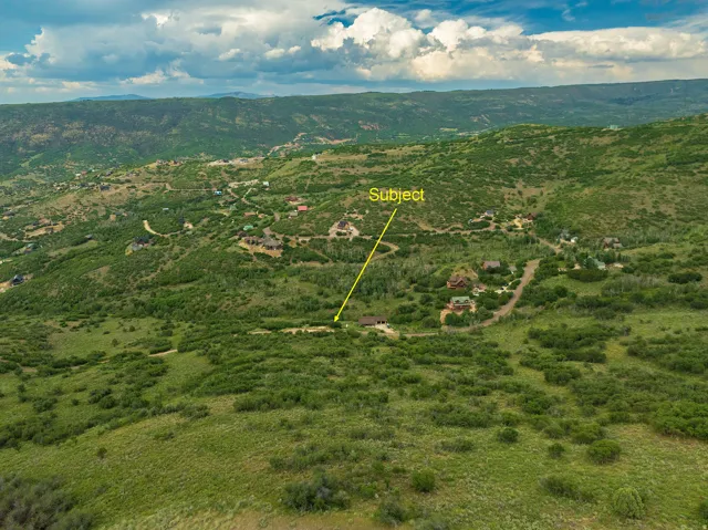 View of property location with a mountain backdrop and property parcel outlined