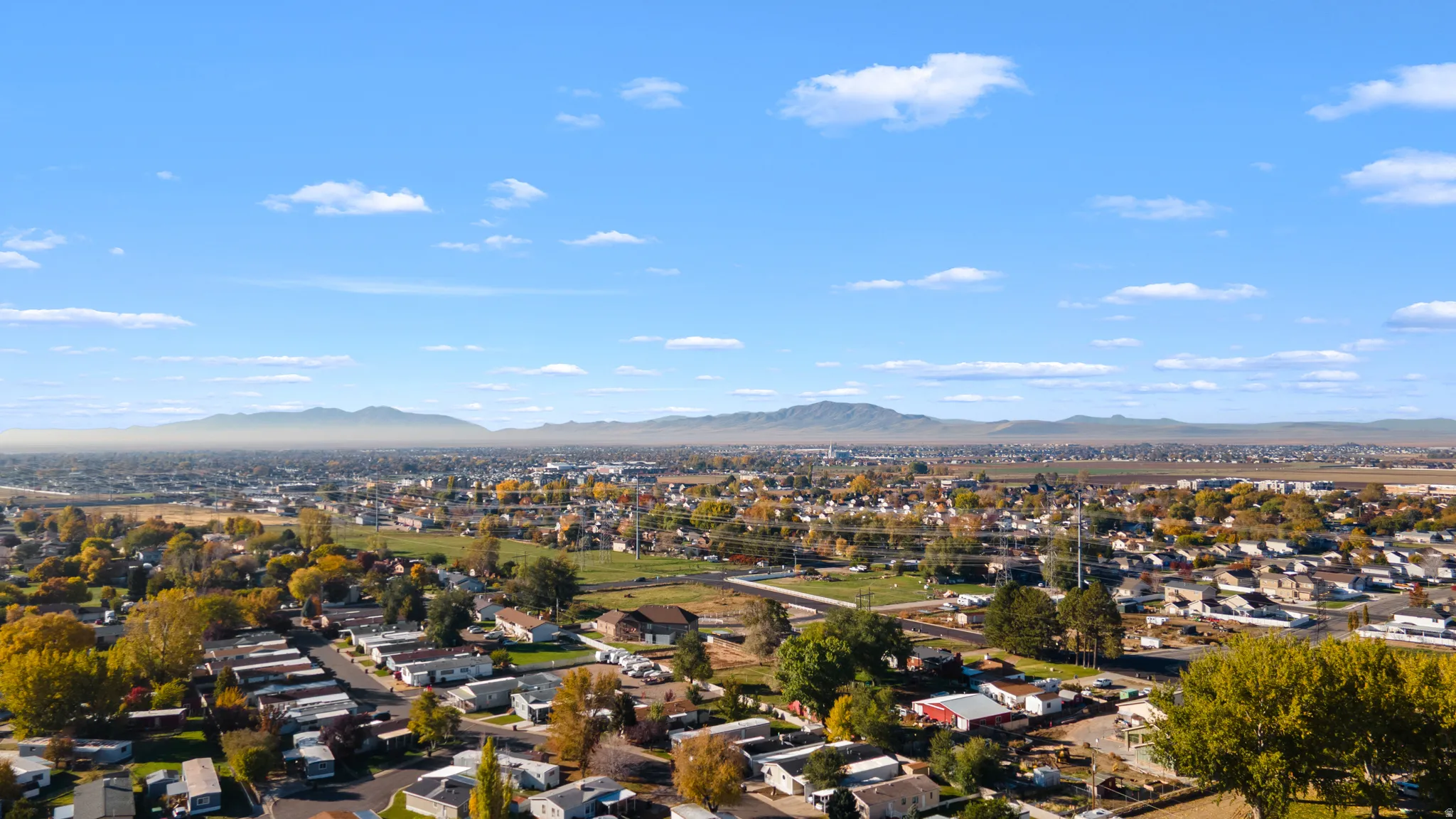 Aerial view of residential area featuring a mountain backdrop