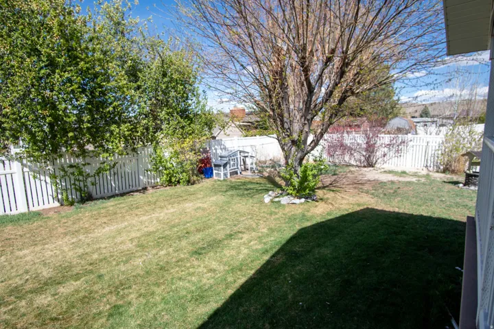 View of fenced backyard