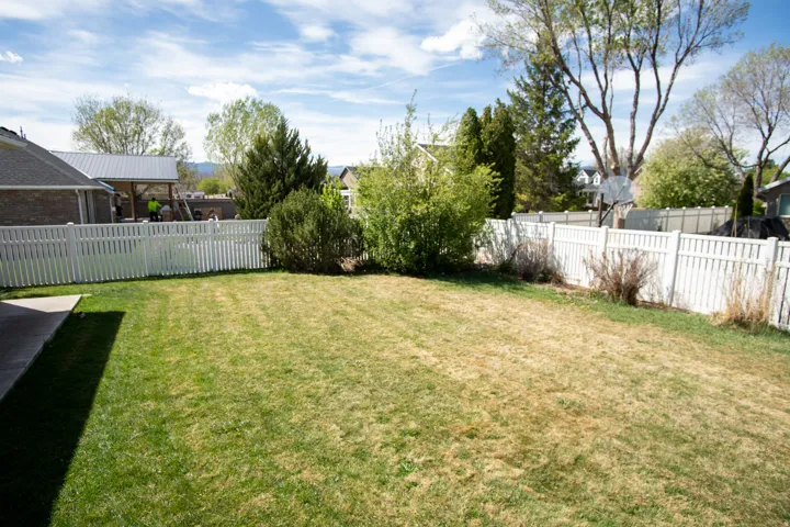 View of fenced backyard